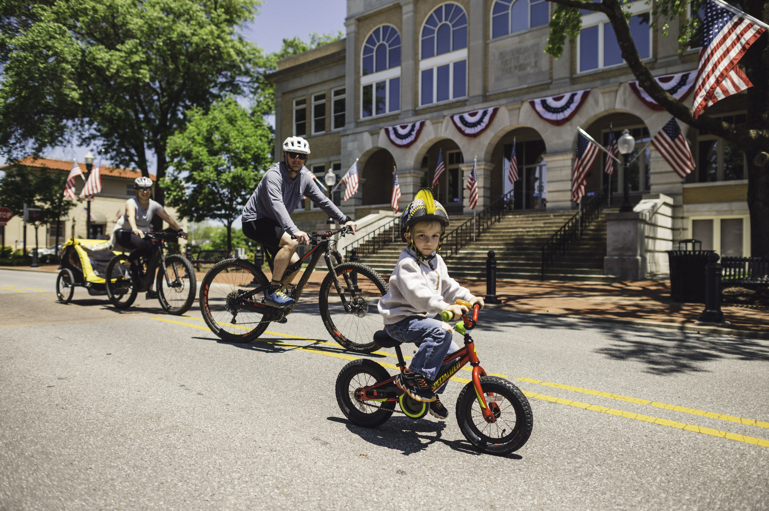 SLOW STREET PILOT PROJECTS: Bike NWA has seen success in Fayetteville and Bentonville (right).&nbsp;
